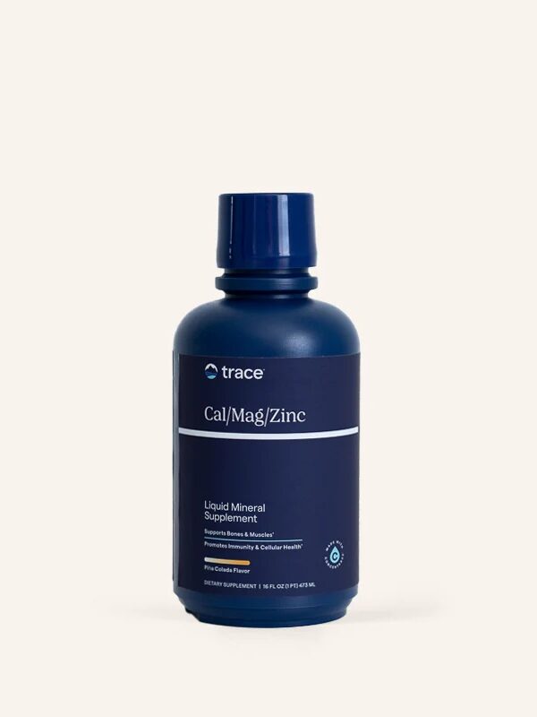 Dark blue bottle labeled "trace Cal/Mag/Zinc Liquid Mineral Supplement," designed to support bones, immunity, and cellular health.