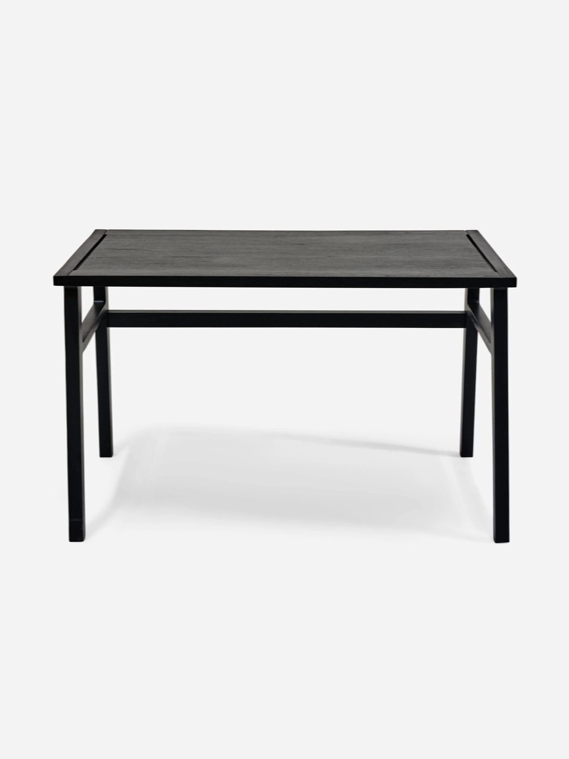 A black rectangular table with a simple design, featuring four straight legs and a flat tabletop.