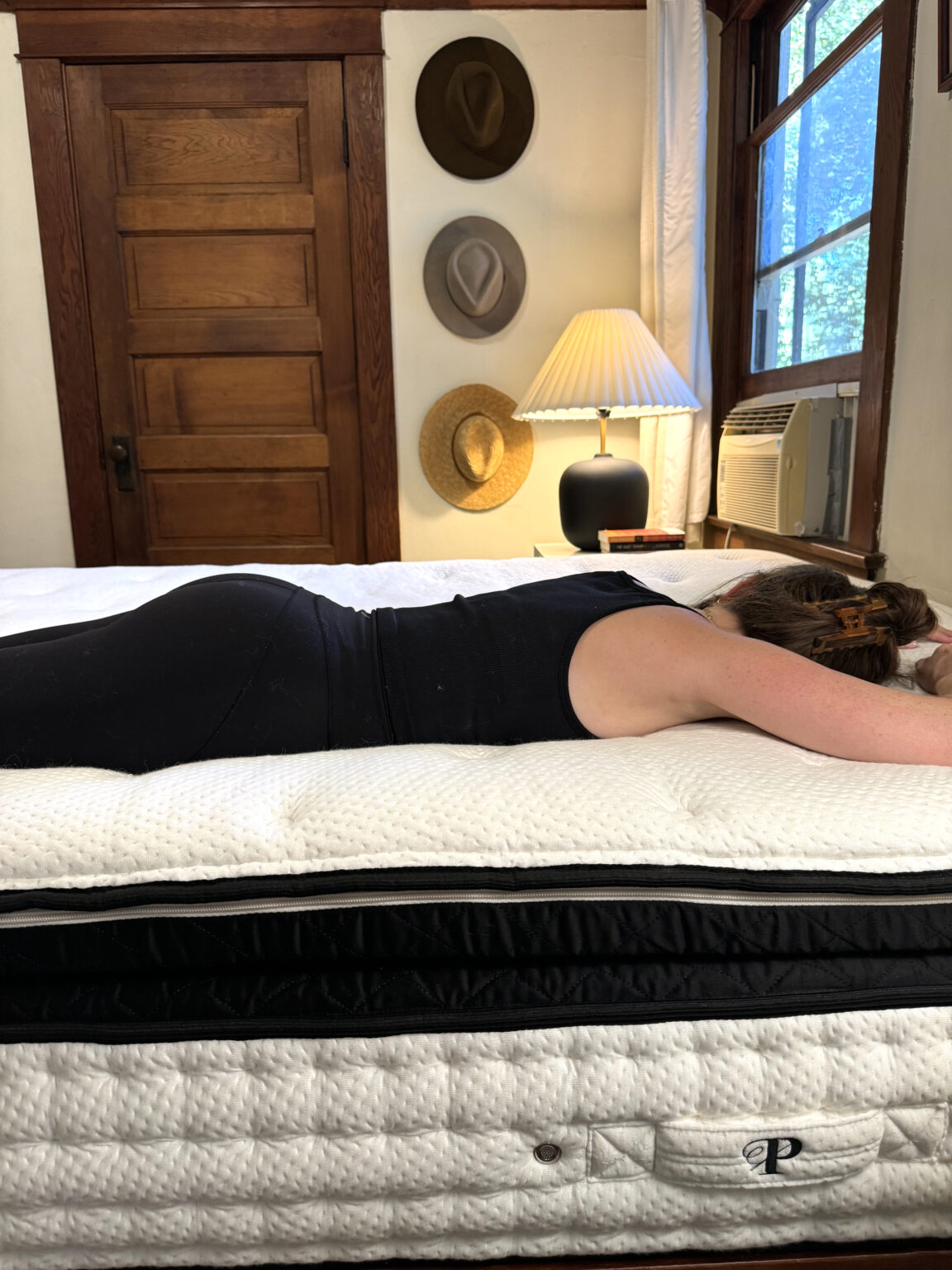 A woman lying on an organic mattress.