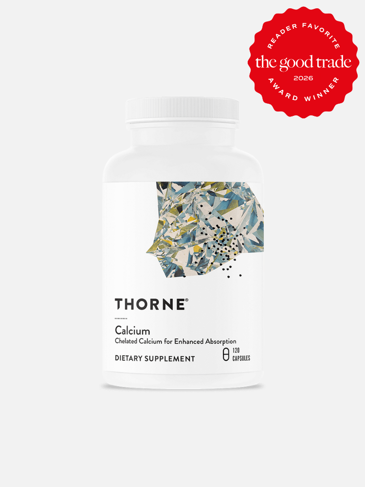 A white bottle of Thorne Calcium dietary supplement with 120 capsules. A red badge in the top right corner reads "Reader Favorite, The Good Trade Award Winner 2026.